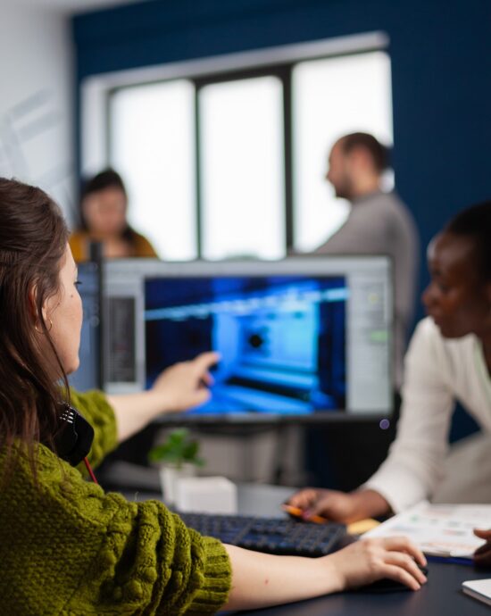 gamer-creator-explaning-african-worker-how-testing-game-level-interface-developing-new-design-creative-office-pointing-screen