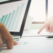 Business concept. Business people discussing the charts and graphs showing the results of their successful teamwork.